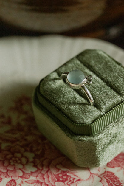 Faceted chalcedony topaz with a sterling silver band - size 12